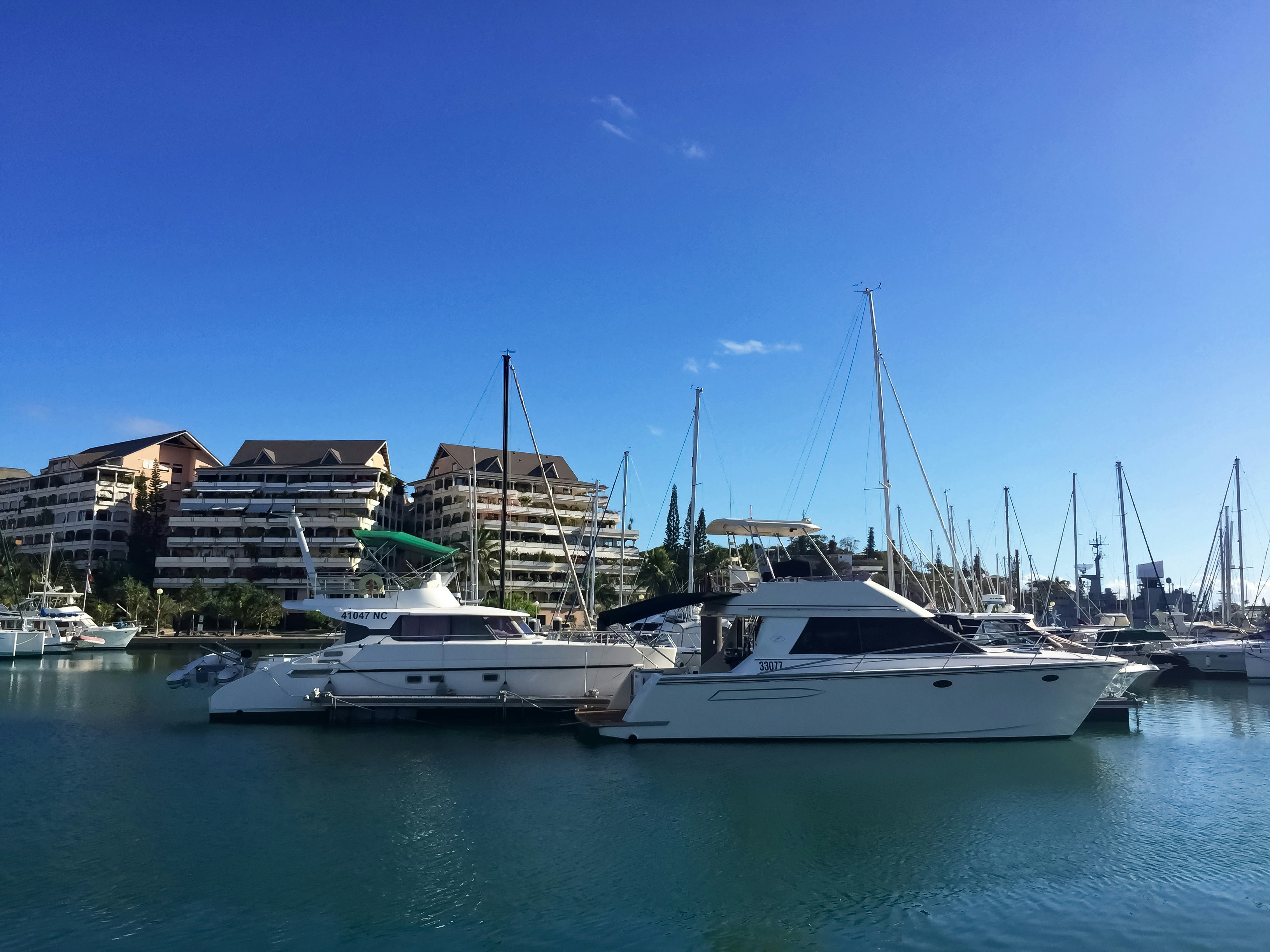 white yacht on sea during daytime